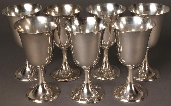 Seven Sterling Silver Goblets, 950 standard: Set of 7 Silver Goblets marked "Sterling 950" on base. In excellent condition with a few scratches. 6 1/2" H x 3 3/8" Diameter. 44.65 troy ounces.