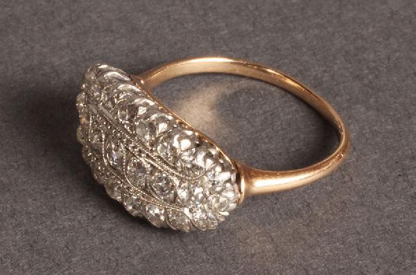 Ladies Edwardian Diamond Ring: Edwardian style gold and platinum diamond ring with 27 old mine cut diamonds. 2 diamonds with chips, 2 prongs missing. Platinum top setting with 14 kt gold ring band. Approximately 1 ct. total diamond