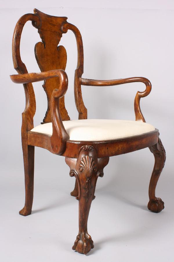 Queen Anne/Chippendale Transitional Style Armchair: Queen Anne/Chippendale Transitional Style Armchair with slip balloon seat. Burled walnut with curved arms, shaped back splat, carved shell legs ending in ball and claw feet. Very good condition. 40" H