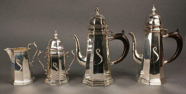 Contential Baroque Silver Tea Service, 4 pcs.: Continental silver four piece tea and coffee service, in the Baroque/Neoclassical transitional style, including coffee (12 1/2" H), tea (12" H), sugar (8 1/4" H) and creamer (6 1/2" H). Octagonal pane