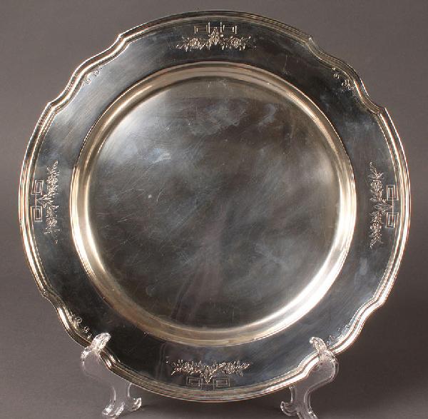 Large Sterling Silver Round Tray or Charger: Sterling tray or charger with embossed floral design border, marked "Sterling, SW511". overall excellent condition with expected wear. 14" Diameter. 28.115 troy ounces. Early 20th century.