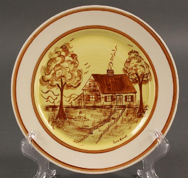 Blue Ridge Porcelain Cabin Scene plate, sgd Hart: Blue Ridge Porcelain (Erwin, Tennessee) Cabin Scene plate, brown on yellow background with brown ring. Signed by artist Ruby S. Hart. overall excellent condition. (10.3" D) Early to mid 20th century. 