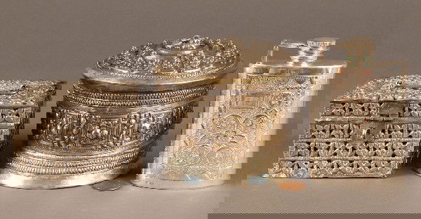 Lot of Three Middle Eastern & Indian Silver pcs: Lot of three Middle Eastern silver items. 1st item: Afghan rectangular hinged perfume box with handle and 2 interior silver containers, the box with pierced and embossed floral decoration, good condit