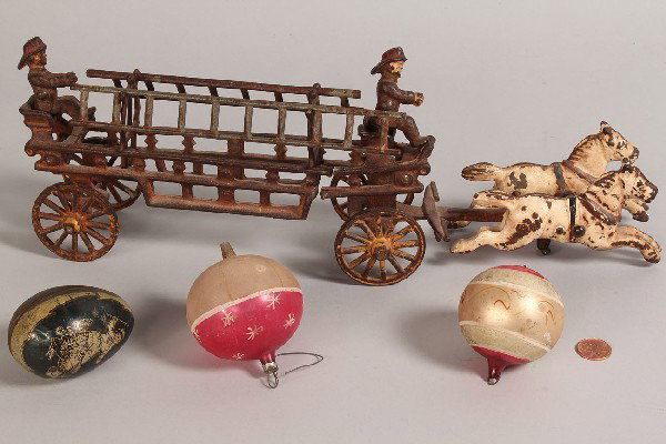Cast Iron Fire Engine and Vintage Holiday Items : Three vintage holiday items and cast iron toy. 1st item: lithographed tin Easter egg, child with hen and eggs. Wear to exterior, some rust to interior. 2nd item: handmade painted blown glass Christmas