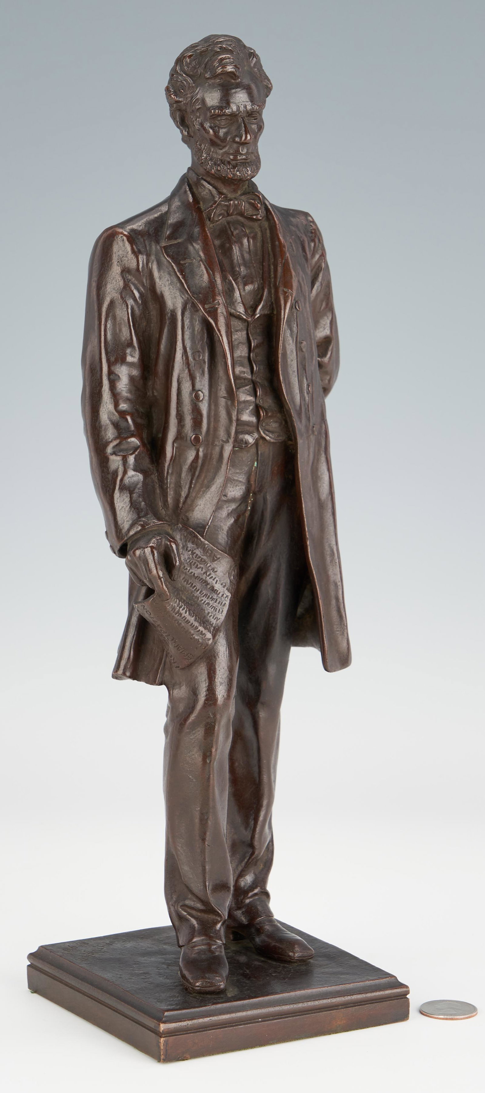 George Edwin Bissell Bronze of President Abraham: George Edwin Bissell (American, 1839-1920) bronze sculpture depicting President Abraham Lincoln, 16th President of the United States, standing and holding a copy of the Emancipation Proclamation in hi