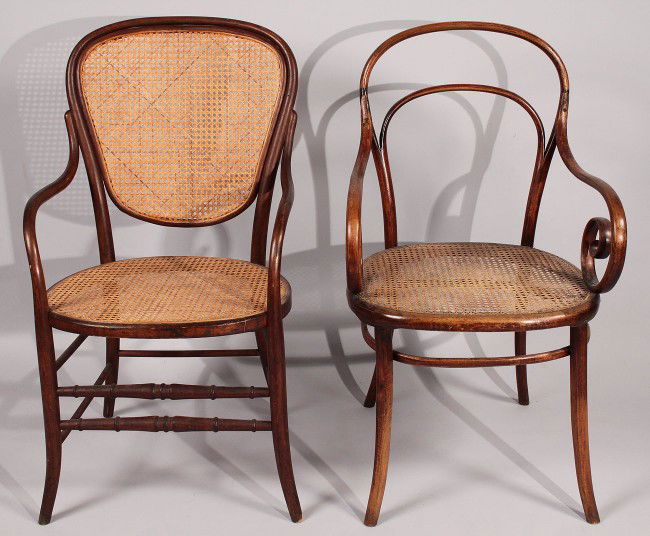 Lot of 2 Thonet Bentwood Armchairs: Lot of 2 Thonet bentwood armchairs. 1st item: Thonet bentwood armchair, caned back and seat. Overall good condition with old repaired break to seat. 39" H x 21" W x 20" D. Late 19th - Early 20th centu