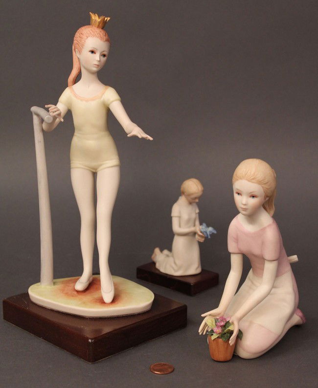 Lot of 3 Cybis figures, Young Girls: Lot of 3 Cybis Young Girl figures: ballerina at stretching bar (mounted on wooden base); girl with bluebird in hands (mounted on wooden base) and girl with flower pot. All are in excellent condition.