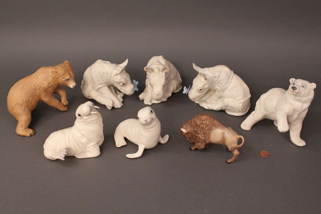 Lot of 8 Cybis Animal figures, wild-themed: Lot of 8 Cybis Animal figures: Tan Bear; Polar Bear "Woolie;" Rhino "Monday" (x2); Rhino; Walrus "Wellington;" Harp Seal "Artic Pup" and Buffalo. All are in excellent condition. Figures range in heigh