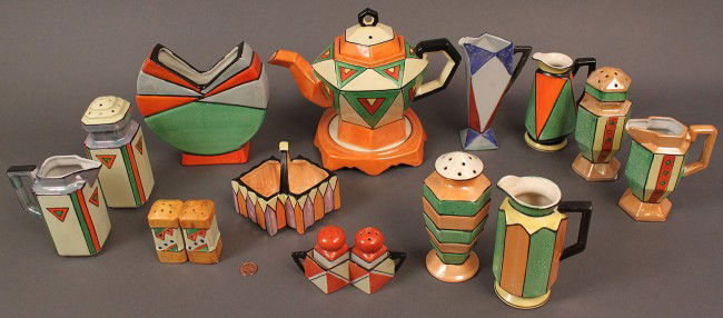 Japanese Art Deco Porcelain Service, 17 pieces: Assembled lot of Art Deco Japanese porcelain in multicolor lustre, matte and semi-matte glazes. One teapot with tile, one vase, 2 sets of muffineers and creamers, 2 sets of salt and pepper shakers, on