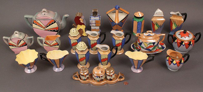 Japanese Art Deco Porcelain Service, 25 pieces: Assembled lot of Art Deco Japanese porcelain in multicolor lustre, matte and semi-matte glazes. One three piece Sunburst teapot set that includes, teapot, creamer and lidded sugar bowl, predominantly 