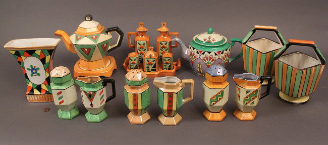 Japanese Art Deco Porcelain Service, 18 pieces: Assembled lot of Art Deco Japanese porcelain in multicolor lustre, matte, and semi-matte glazes. Two teapots, one with tile, a condiment set containing tray holding oil, vinegar, salt & pepper, and co