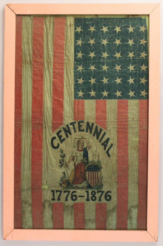 Framed U.S. Centennial Flag: Framed U.S. Centennial exposition flag, cotton with 36-stars, central panel with standing Miss Liberty with spear, U.S. shield and eagle at her feet with flag background and the text Centennial above 