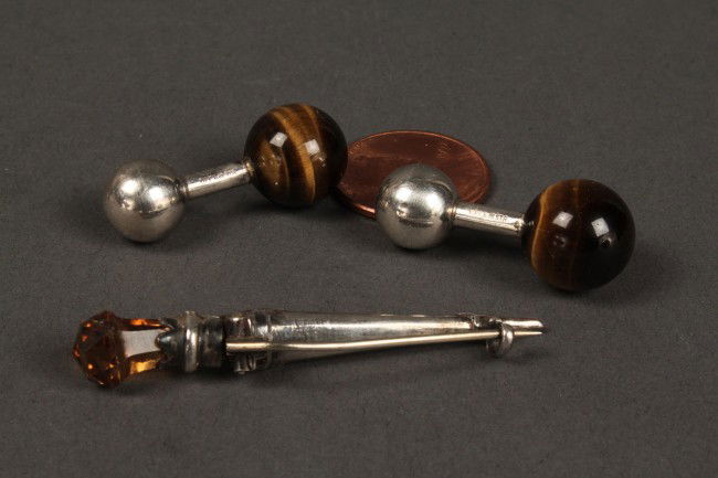 Blood Stone Dirk Pin and Tiger Eye Cufflinks: Blood Stone Dirk Pin and Tiger Eye Cuff links. 1ST ITEM: Dirk (kilt) pin dagger design w/ Carnelian, blood stone. Overall very good condition. Unmarked. 1 2/3" L. European. Early 20th Century. 2ND ITE