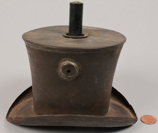 Tin Political Parade Torch: Tin political parade torch in the shape of a beaver top hat, most likely used during the James Buchanan political campaign. Condition - missing its wire trunnion. 5 3/4" H x 6 1/2" D x 4 3/4" W. Mid 1