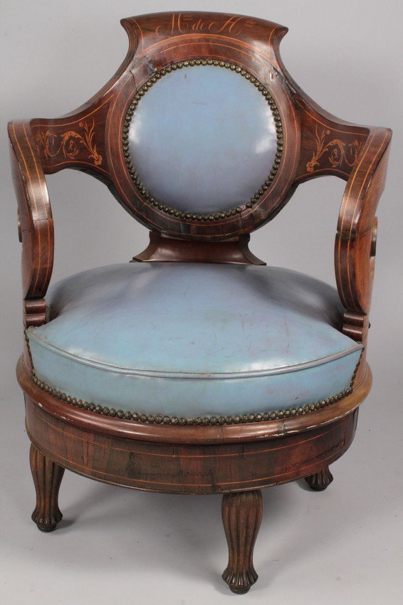 Continental marquetry armchair, 19th century: Continental fruitwood marquetry armchair with blue leather upholstery. Backrest inlaid with letters "M rio de H da", inside of scroll arms inlaid with floral sprays. Blue leather upholstered seat and 