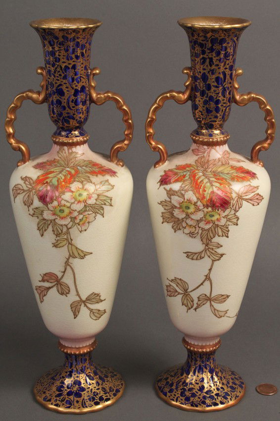 Pair Carlton Ware Ceramic Vases: Pair of ceramic vases, hand painted floral and insect decoration with gilt and cobalt decorated base and neck, marked "Stoke-on-Trent/ Carlton Ware" on base and numbered "57/1776". Excellent condition