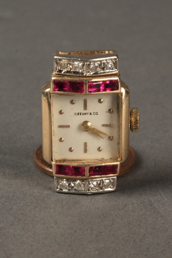 14k Diamond and Ruby Tiffany Watch Face: 14K Diamond and red stone Tiffany Watch Face by Hamilton. Contains 8 diamonds and 4 red stones. Diamonds are approximately H color, VS clarity. 22 jewels mechanism. Works are ticking but functionality