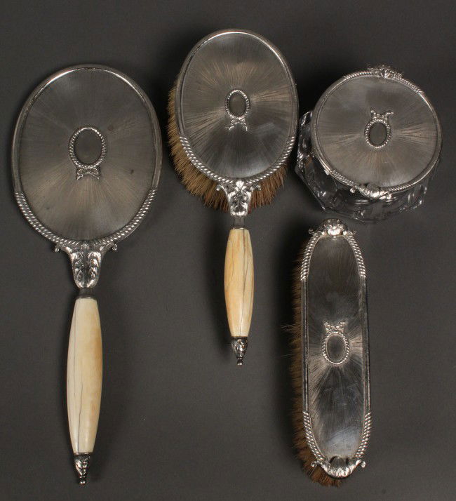 M. Buccellati Italian dresser set: M. Buccellati silver Dresser set, 4 pieces. Satin finish with rope, ribbon and acanthus decoration, bone handles, includes hand mirror, hairbrush, clothing brush, powder jar with silver lid, marked "M