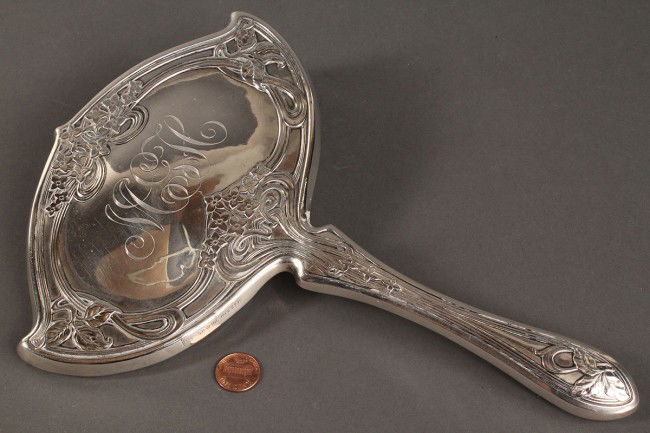 Sterling Art Nouveau Mirror, Foster & Bailey: Art Nouveau sterling silver hand mirror, marked for the Foster and Bailey company of Providence, Rhode Island. Overall good condition with some surface scratching to silver and some darkening of mirro
