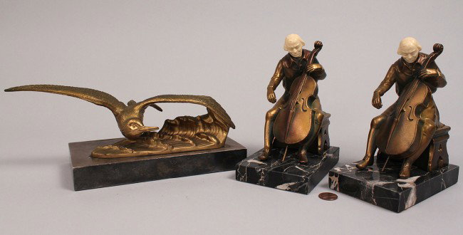J Ruhl Bookends & Jennings Bros. Sculpture: J Ruhl Bookends & Jennings Bros. Sculpture. 1ST ITEM - Pair of J. Ruhl bookends made by JB Hirsch, 1932, featuring a seated cellist with an ivory type (celluloid) head mounted on a black and white mar