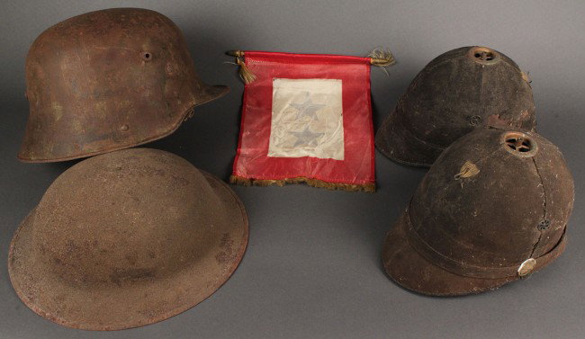 Lot of 4 Helmets, World War I & 19th c. Army Spike: Lot of 2 World War II helmets & 2 19th Century Hats. 1st item - Lot of two J. H. McKenney U. S. Army spike helmets, cloth with artillery side buttons, small brass shield. Condition - Wear and losses t