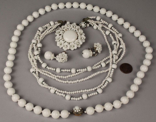 Four Items of Miriam Haskell Jewelry: 4 Items of Miriam Haskell Jewelry. 1ST ITEM: White flower brooch and matching flower drop earrings. The brooch has silver metal filligree mount with maker's mark. Very good condition, 2" diameter. Mat