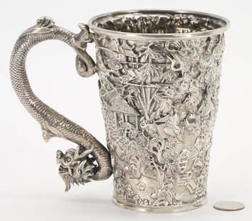 Chinese Export Silver Dragon Mug: Chinese Export Silver Mug or Cann, circular tapering form with repousse decoration of multiple figures in landscape settings, with pagodas, trees, mountains and bamboo. Figural qiulong dragon handle.