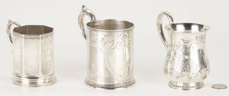 3 Coin Silver Mugs incl. Harding, Tift & Whiting, Cooper & Fisher: Three (3) Northern Coin Silver mugs, including Massachusetts, New York City. 1st item: Coin silver mug, having a pear-shaped body with scrolling foliate engraved decoration and cartouche, modeled