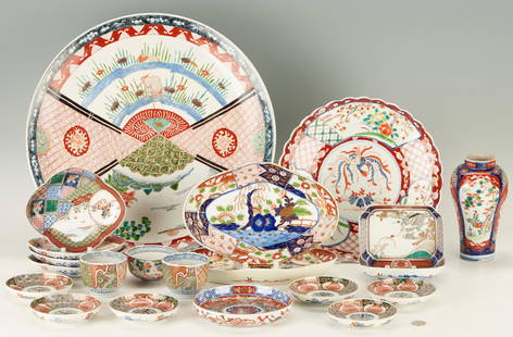 21 Assorted Imari Porcelain Items incl. Charger: A group of twenty-one (21) assorted Japanese Imari porcelain items: including one (1) large round charger with landscape and diapered vignette decoration to the top and landscape vignette decoration