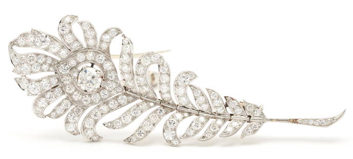 French Art Deco Platinum & Diamond Feather Brooch: Ladies French Art Deco period platinum feather brooch featuring a Euro cut diamond approximately 0.59 carats, Clarity-SI1, Color-H accented by 128 diamonds (round brilliant, Euro, old mine, single,