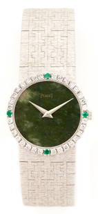 Ladies Piaget 18K Diamond & Emerald Watch, Jade Dial: Ladies 18K white gold Piaget wrist watch featuring 32 round brilliant diamonds approximately 0.96 carats, Clarity-VS2, Color-H, accented by 4 natural emeralds. Jeweled mechanical movement, green jade