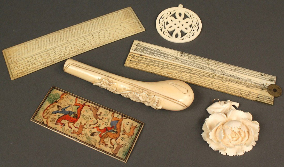 Lot of 6 carved ivory, bone and walrus items: Lot of ivory items including one (1) ivory frame (5" x 4-3/4"), one (1) carved walrus parasol handle with leaf decoration (5-1/8" L), one (1) carved ivory flower (2-1/4" L), one (1) carved ivory knot 