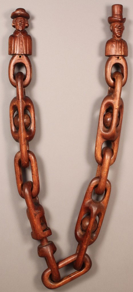 Folk Art Wooden Carved Figures & Chain: Carved wood male figures, joined by chains with enclosed balls, all one piece of wood. Unsigned. 73" H x 3" W (approximate overall). Probably Southern. Late 19th/early 20th century. Provenance: Estate