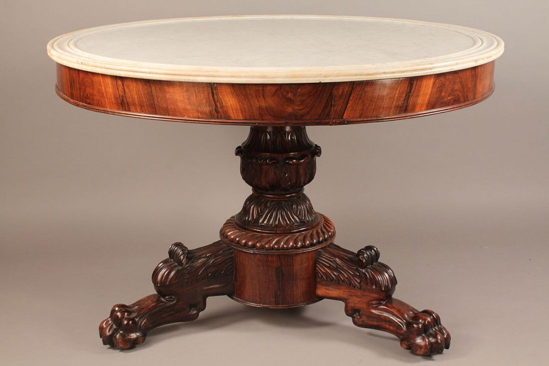 American Classical Center Table with Marble Top: A fine American Classical rosewood center table, white marble dish top, well carved foliate pedestal on a gadrooned circular plinth base with 3 finely carved paw feet. 27 1/2"h x 41 1/2" dia. American