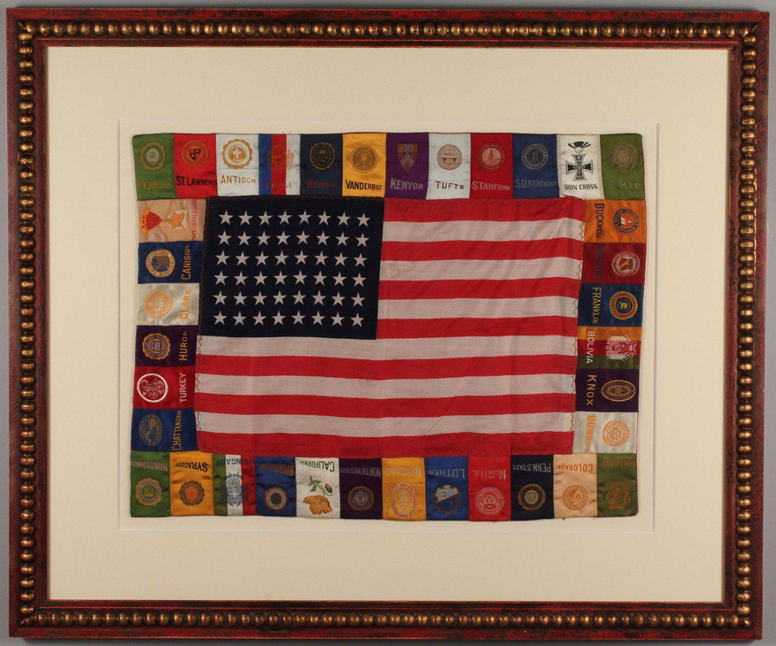 Framed 48 star flag with college pennants: Framed silk American 48 star flag with college silk pendants attached around the complete border of the flag. Early 20th century. Sight- 14 1/2" H x 19 1/2" W. Framed- 24" H x 29" W. Provenance: estat
