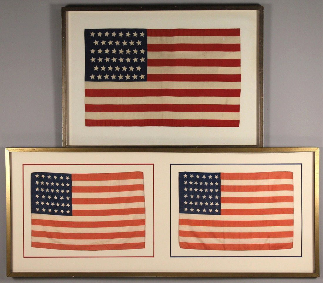Framed flags, a 46 star & double framed 39 stars: 1ST ITEM: 46 star flag, cotton, framed. 15" H x 24" W. Early 20th century. 2ND ITEM: A double framed display of two silk 39 star American flags, probably for parade. Flags from 3rd quarter of the 19th