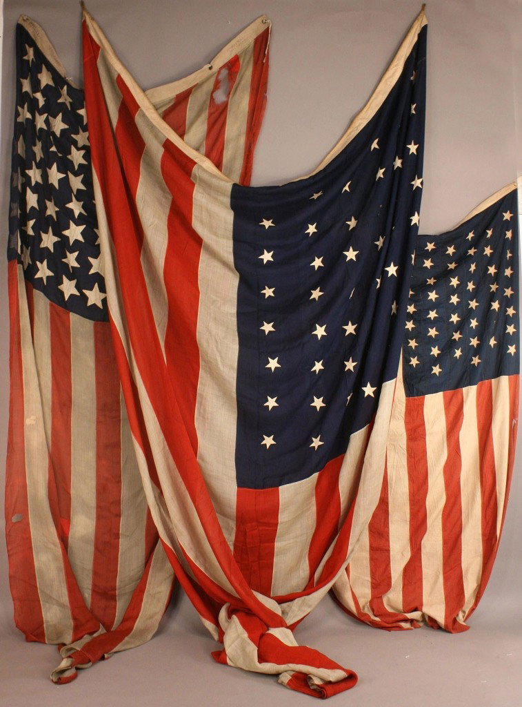 Three 45 star flags, Horstmann & prob. Naval: 1ST ITEM: Very large American national flag, 45 stars, single ply wool with machine stitched double applique stars, rope hoist, approximately 15' x 9'. Circa 1908. 2ND ITEM: 45 Star American national 