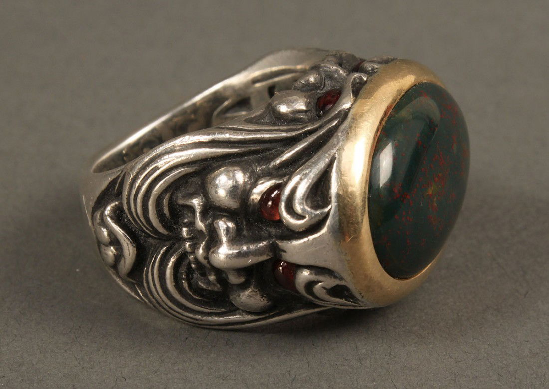 Stephen Webster Ring, London Calling Gargoyles: Stephen Webster 18K yellow gold and sterling silver "London Calling" two-faced gargoyle ring with oval cabochon bloodstone set in18kt gold bezel and with garnet eyes. Designer's mark, 925 and 750 mark