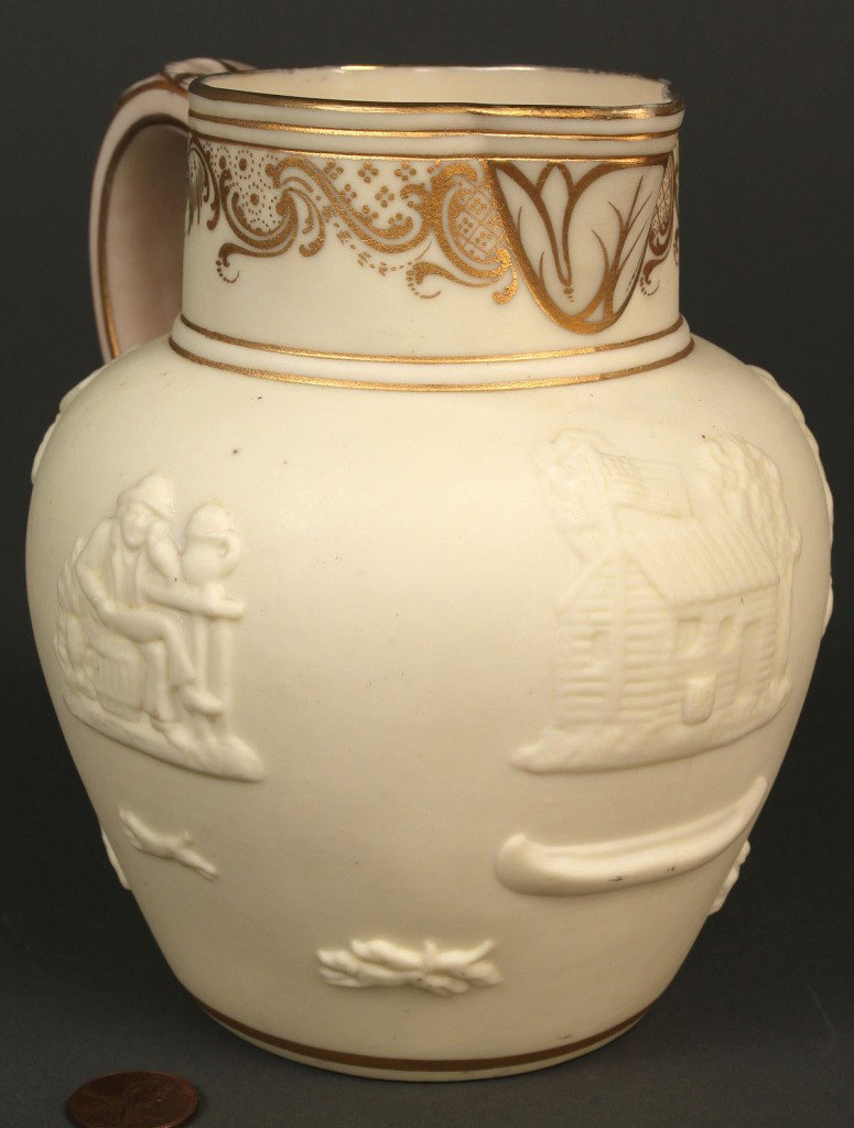 William Henry Harrison Campaign Pitcher: William Henry Harrison porcelain campaign pitcher, thin ivory bisque exterior with relief decoration including the Harrison log cabin with cider barrel and flying flag, windmill, canoe, seated man wit