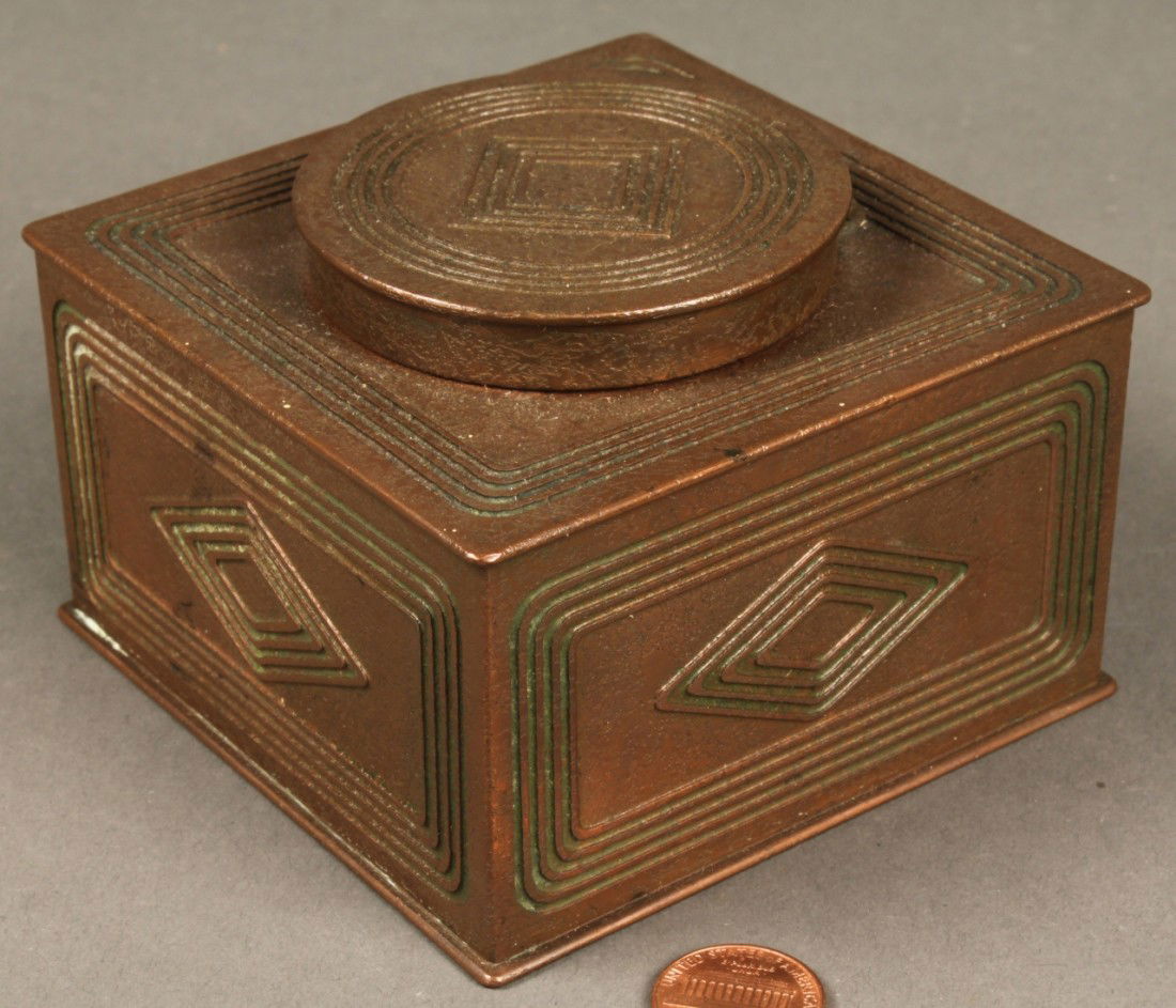 Tiffany Bronze Inkwell, Graduate Pattern: Tiffany bronze Graduate pattern inkwell. Stamped on base "Tiffany Studios, New York, 1801". 2 1/2" H x 3 3/4" W x 3 3/4" D.