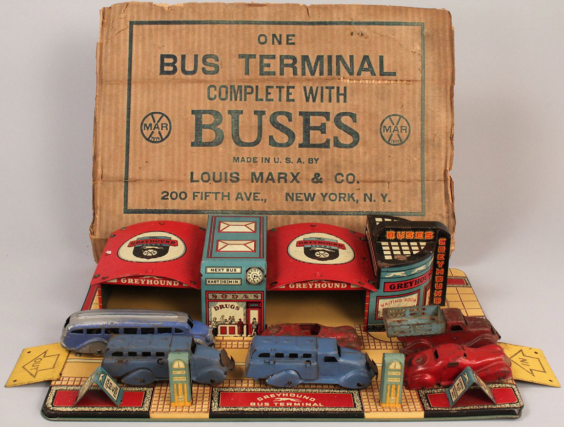 Marx Tin Litho Greyhound Bus Terminal Toy: Tin Litho Marx Greyhound Bus Terminal Toy, with 2 original tin toy buses, one later bus marked "Greyhound", 2 red tin sedans, and a tin truck with original box top from the Louis Marx Company. Termina