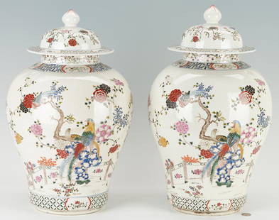 Pair Large Famille Rose Porcelain Covered Jars: Pair of two (2) large Famille Rose porcelain jars, likely Chinese, baluster form, having polychrome enamel decoration of exotic birds resting on flowering branches surrounded by fences; the upper and