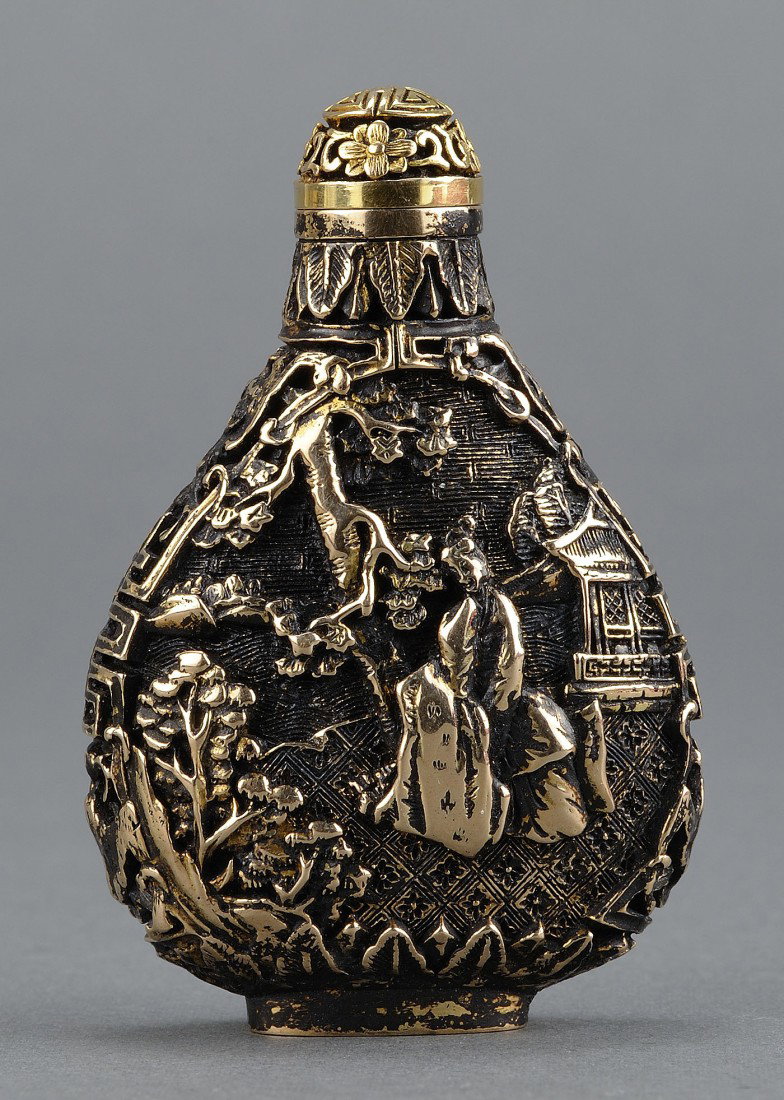 Chinese 14K Gold Carved Snuff Bottle, 83.8 grams: Chinese 14K gold (tested) snuff bottle with relief carved figures and pagoda. 83.8 grams. Marked on base. 2-3/4" H. 20th century. Provenance: From the collection of the late Fred C. Kennedy, a renowne