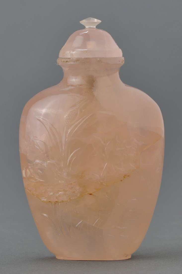 Chinese Carved Rose Quartz Snuff Bottle: Chinese carved rose quartz snuff bottle with flowers and ducks, en suite with lid. 2-1/2" H. 20th century. Provenance: From the collection of the late Fred C. Kennedy, a renowned mineral collector and