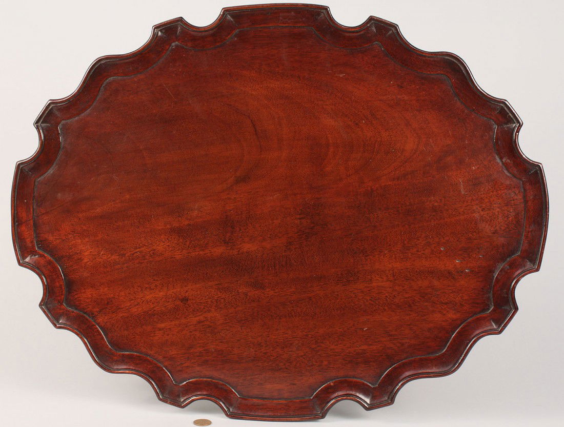 Chippendale mahogany pie crust tea tray: Chippendale carved mahogany tea tray, oval, with pie crust edge. 22" x 17". English, 18th century. Provenance: Estate of Salli LaGrone, Franklin, Tennessee.