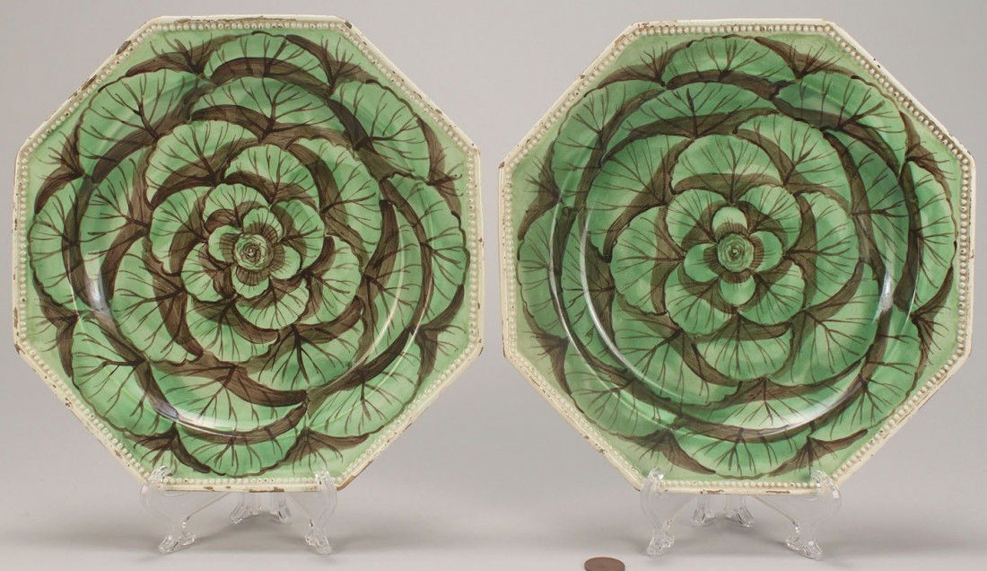 2 creamware cabbage leaf plates: Two octagonal creamware plates with polychrome cabbage leaf decoration, beaded molded edges, 9" diameter. Probably French, circa 1790. Provenance: Christie's, The Old Vicarage Sale 23 Sept. 1998 (labe