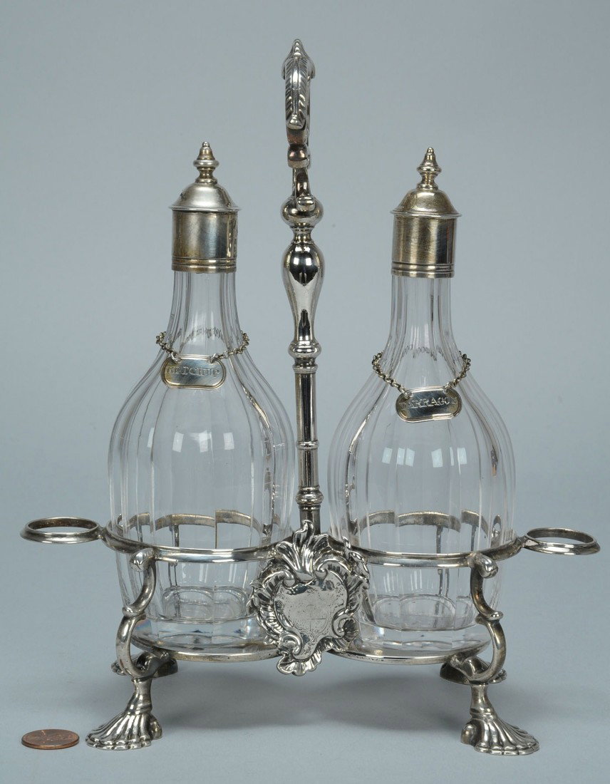 George II Sterling Cruet, Jabez Daniel: English George II sterling silver cruet frame in the Rococo taste, with a shell and scroll cartouche shaped handle atop a baluster arm, an applied asymmetrical cartouche with engraved armorial crest,