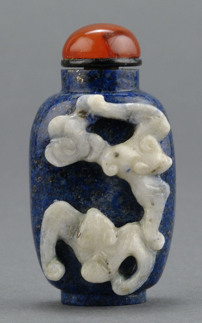 Chinese Carved Lapis Snuff Bottle: Chinese carved lapis snuff bottle with carved bats. 2 1/4" H. 20th century. Provenance: From the collection of the late Fred C. Kennedy, a renowned mineral collector and member of The Chinese Snuff Bo