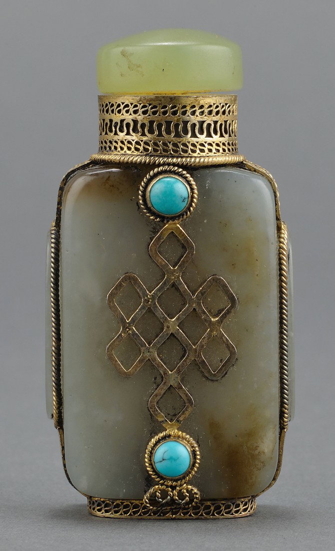 Chinese Mongolian Jade Snuff Bottle: Chinese Mongolian green jade and hardstone snuff bottle, flattened and rectangular form with gilt metal overlay decoration. 2 7/8" H. 20th century. Provenance: From the collection of the late Fred C. 