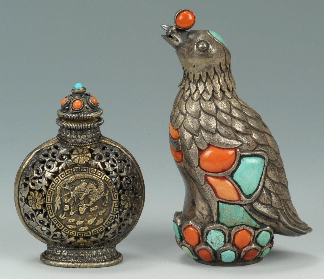 2 Asian Metal & Hardstone Snuff Bottles: 2 Asian metal and hardstone snuff bottles. 1st item - Chinese Mongolian metal openwork snuff bottle, dragon chasing pearl decoration with domed top adorned with coral and turquoise 2nd item - Asian si